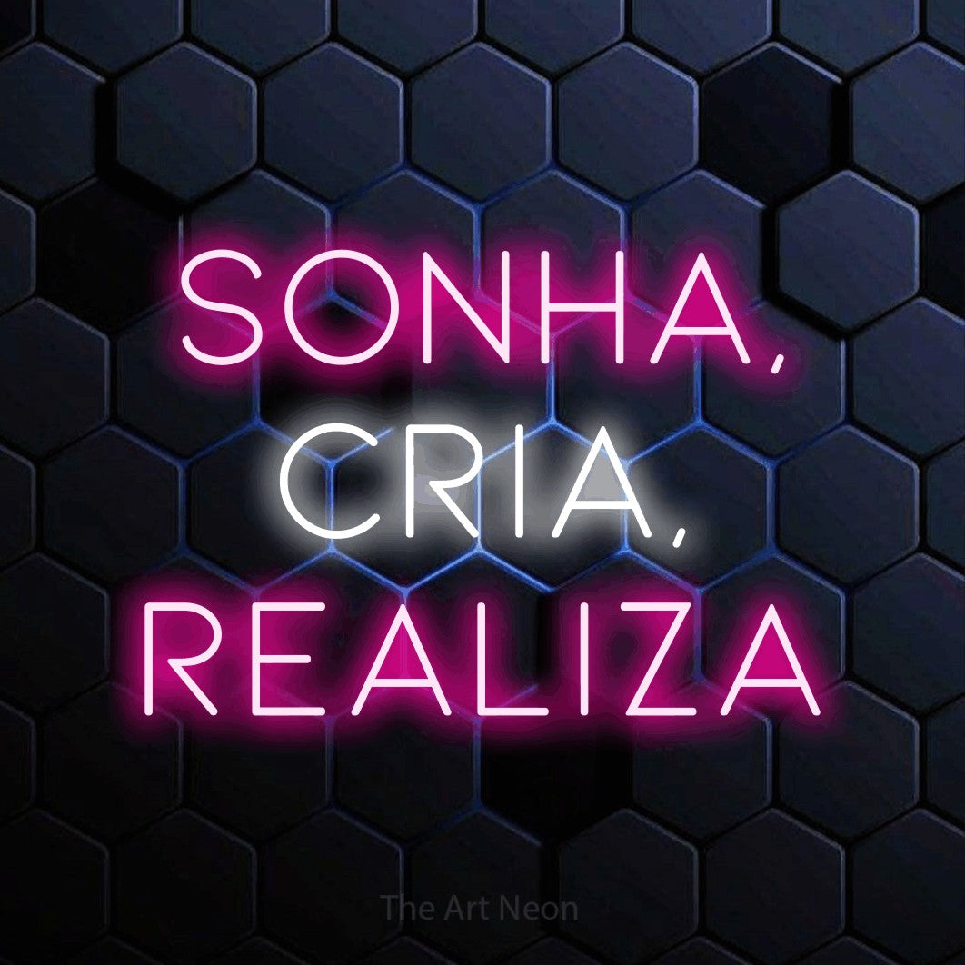 LED neon sign reading “SONHA, CRIA, REALIZA”, arranged in 3 lines.