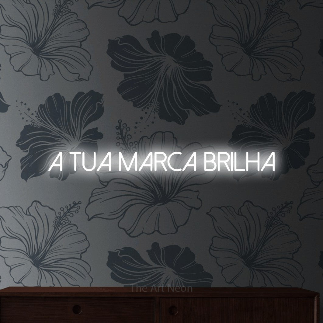 LED neon sign reading “A Tua Marca Brilha”, arranged in a single line.