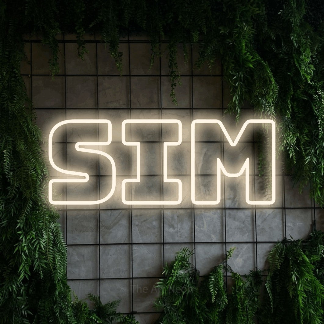 LED neon sign reading “sim”, arranged in a single line.