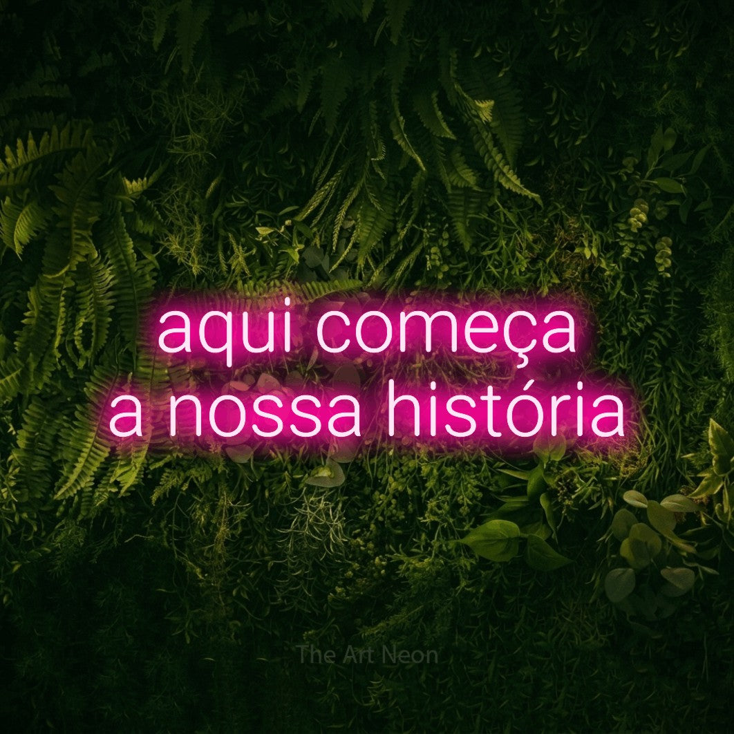 LED neon sign reading “aqui começa a nossa história”, arranged in 2 lines.