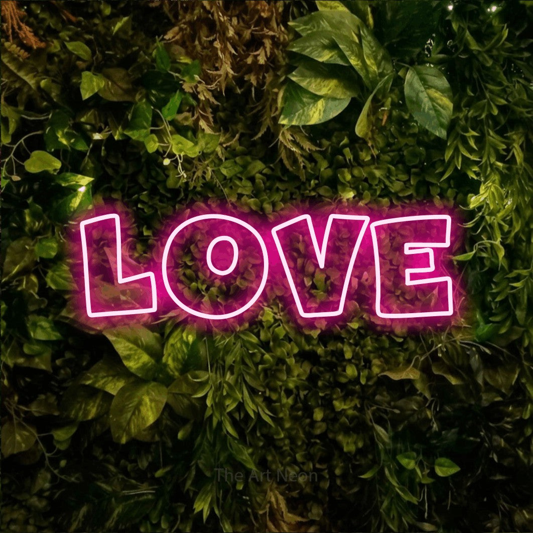 LED neon sign reading “LOVE”, arranged in a single line.