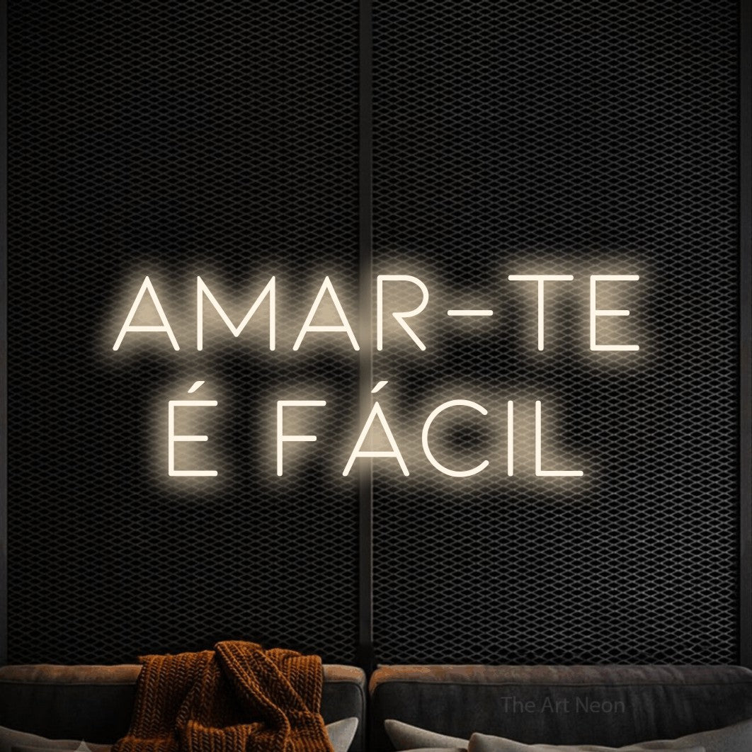 LED neon sign reading “AMAR-TE é fácil”, arranged in 2 lines.