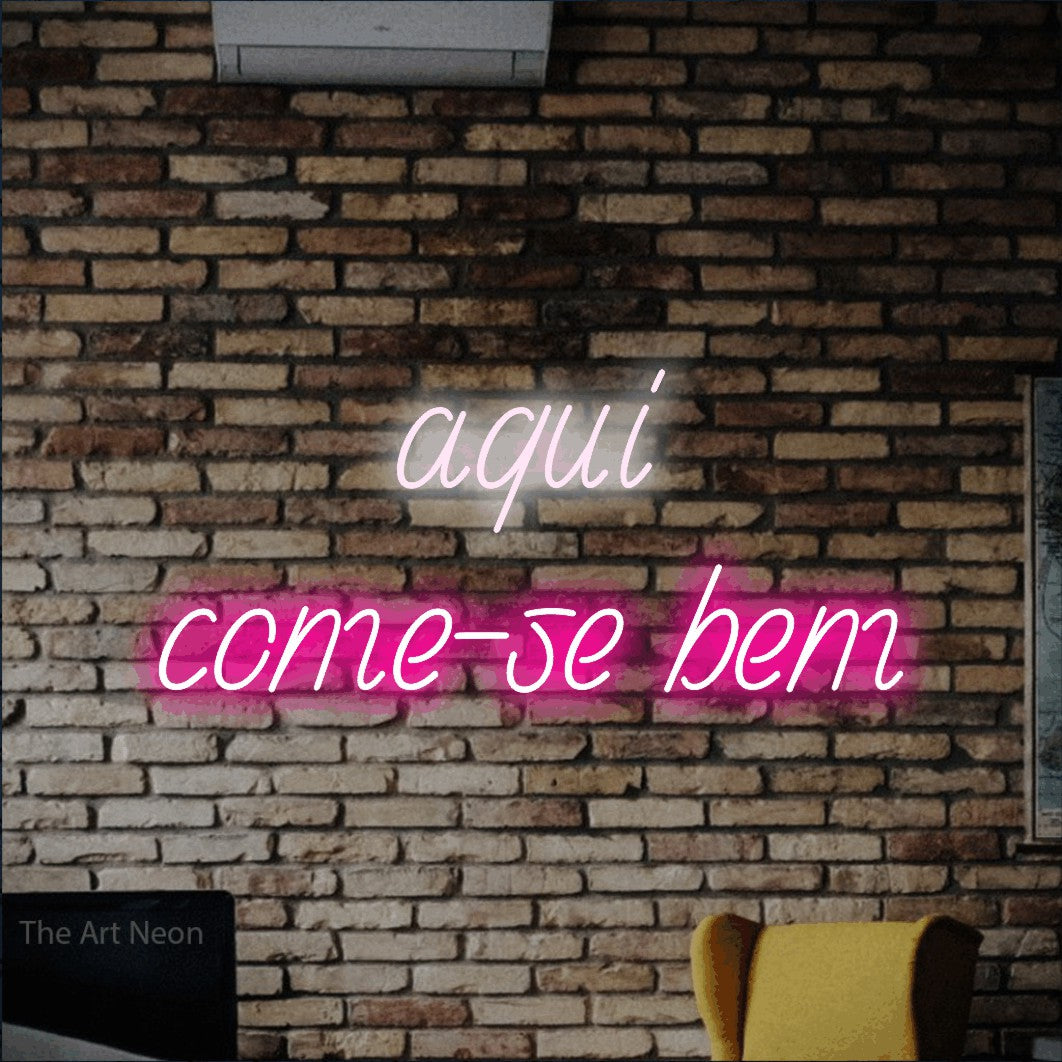 LED neon sign reading “aqui come-se bem”, arranged in 2 lines.