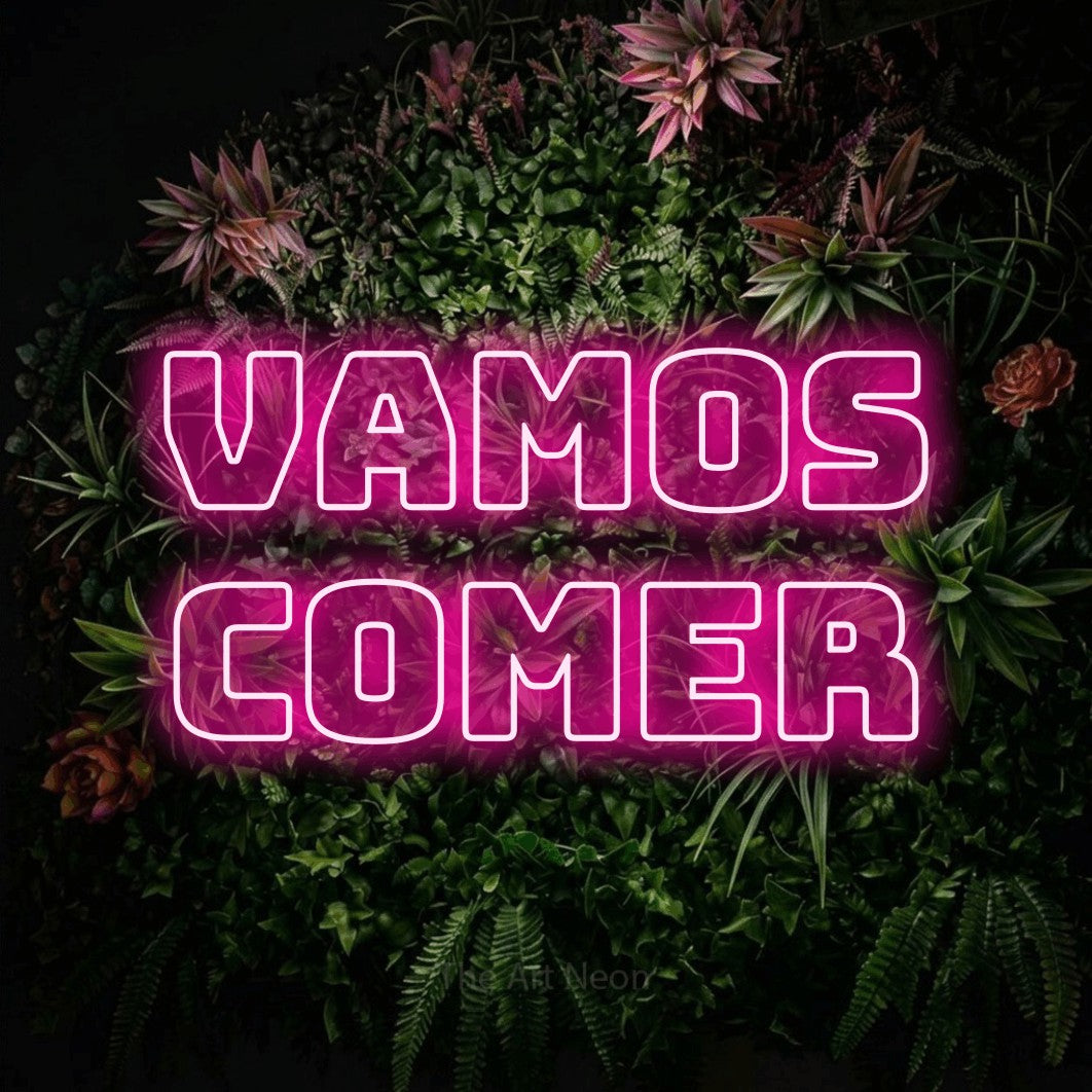 LED neon sign reading “vamos comer”, arranged in 2 lines.