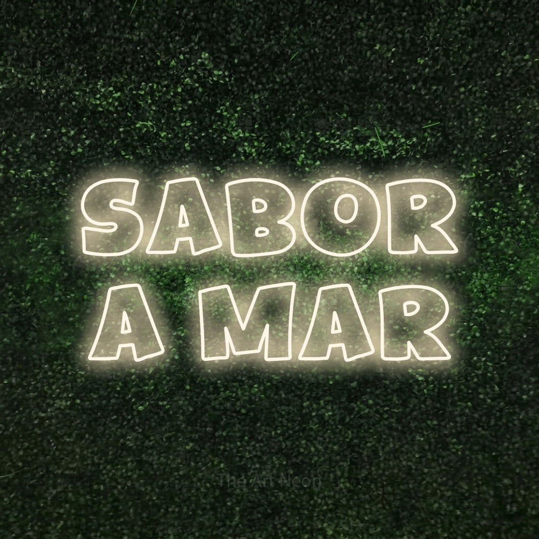 LED neon sign reading “Sabor a Mar”, arranged in 2 lines.