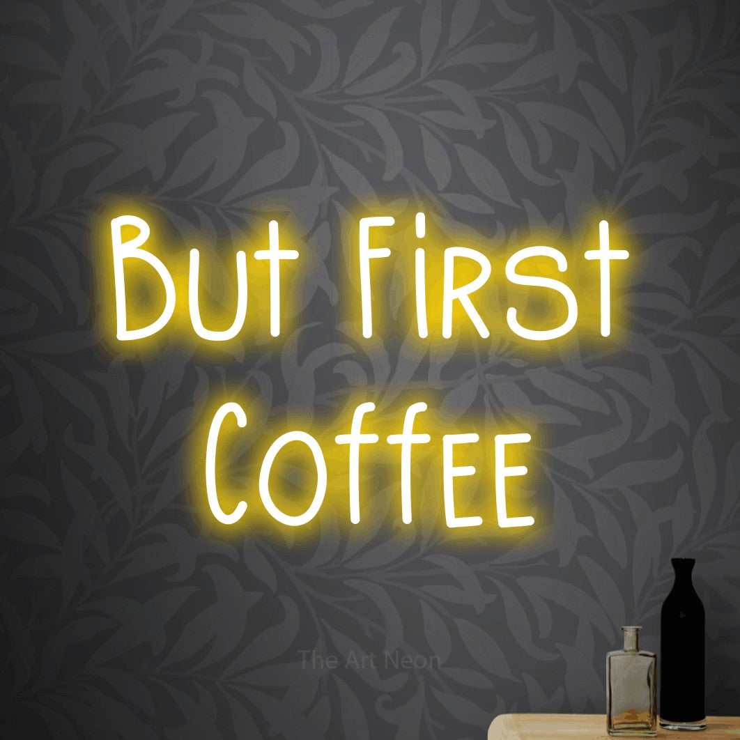 LED neon sign reading “But First Coffee”, arranged in 2 lines.