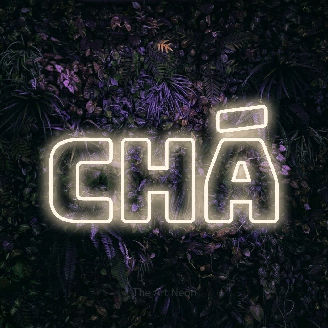 LED neon sign reading “chá”, arranged in a single line.