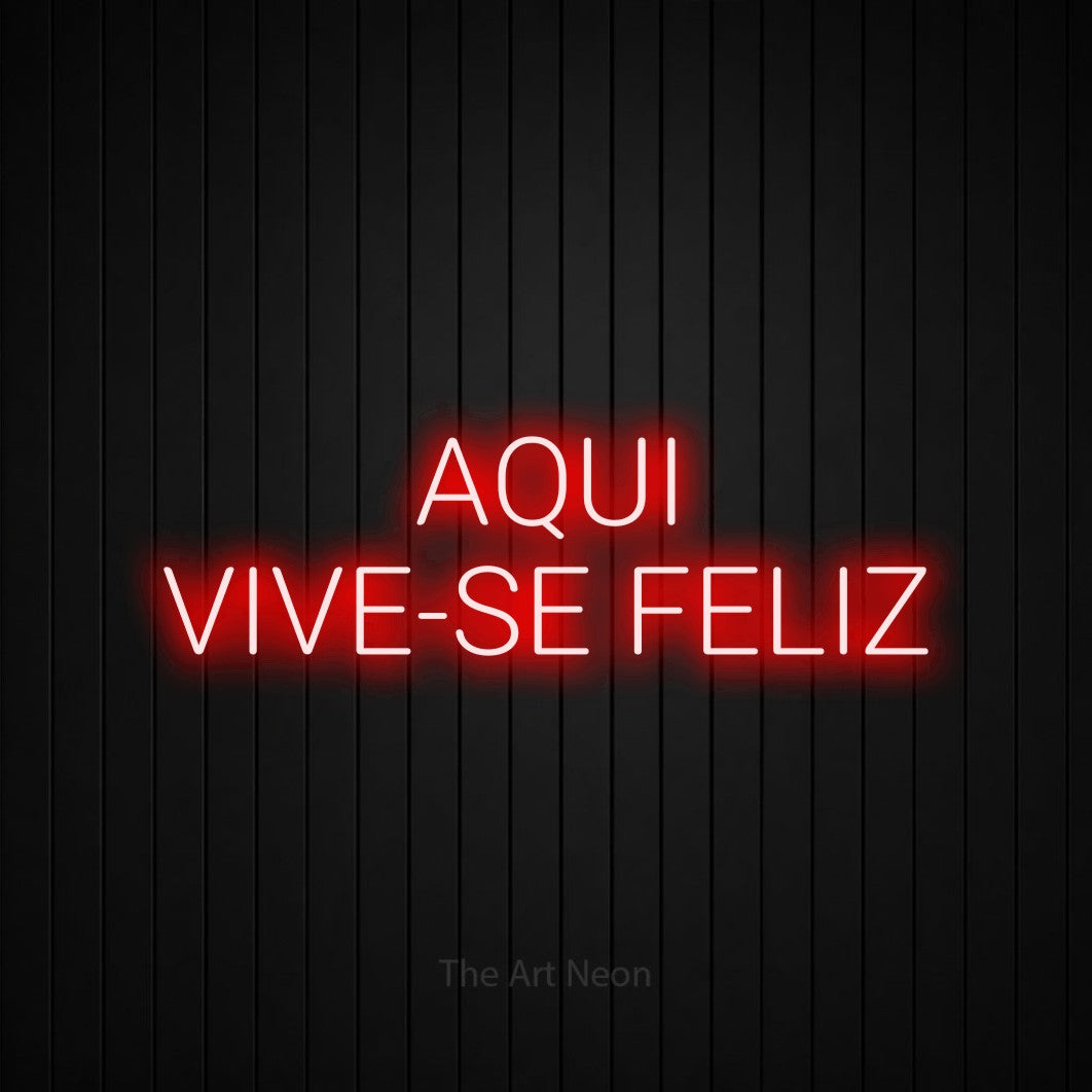 LED neon sign reading “AQUI VIVE-SE FELIZ”, arranged in 2 lines.