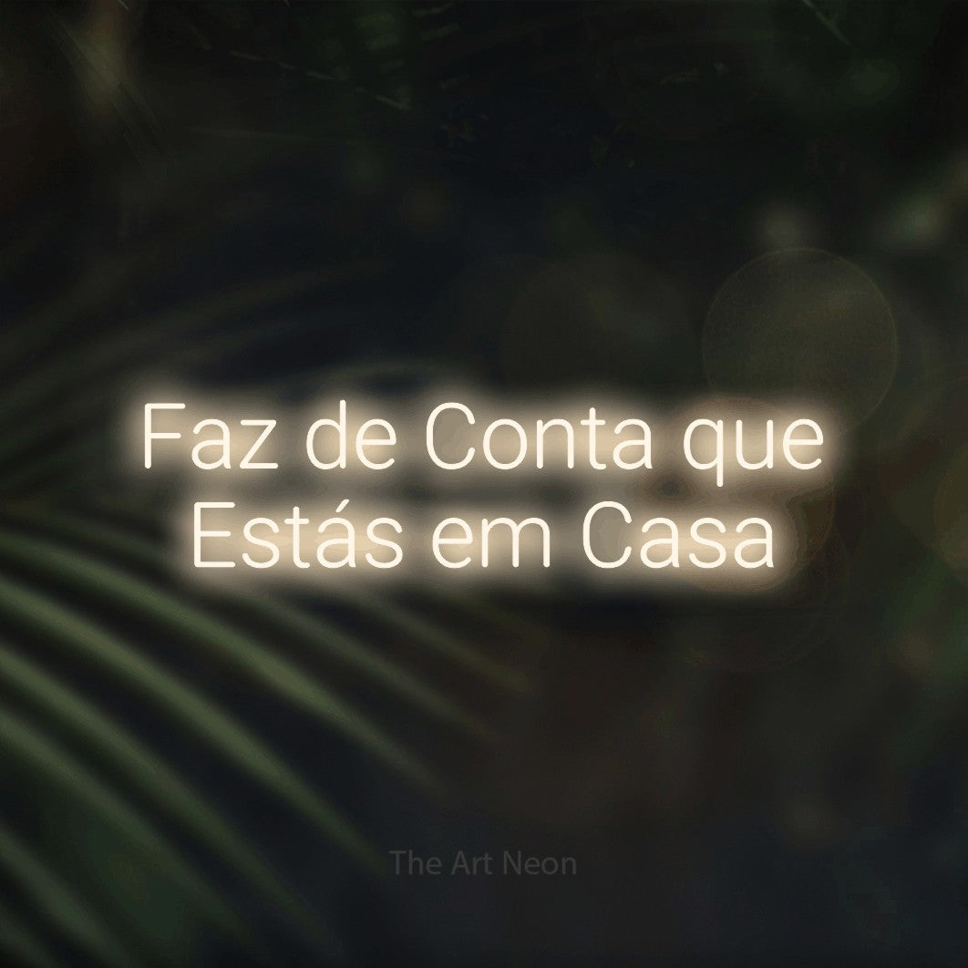 LED neon sign reading “Faz de Conta que Estás em Casa”, arranged in 2 lines.