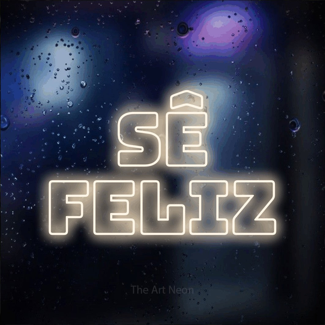 LED neon sign reading “Sê feliz”, arranged in 2 lines.
