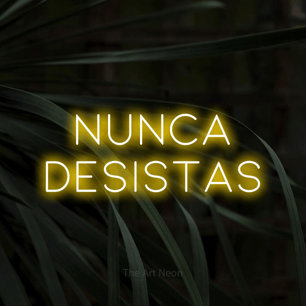 LED neon sign reading “NUNCA DESISTAS”, arranged in 2 lines.