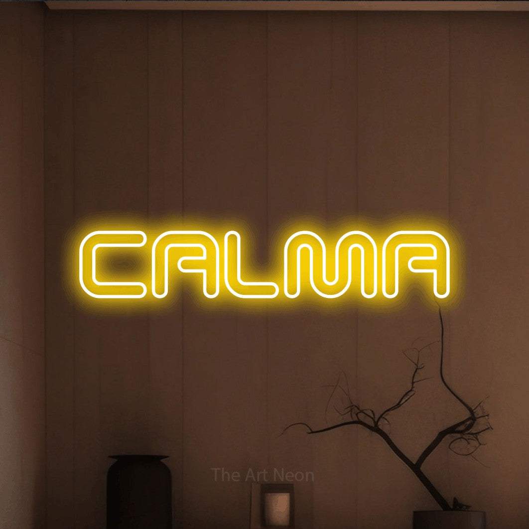 LED neon sign reading “CALMA”, arranged in a single line.