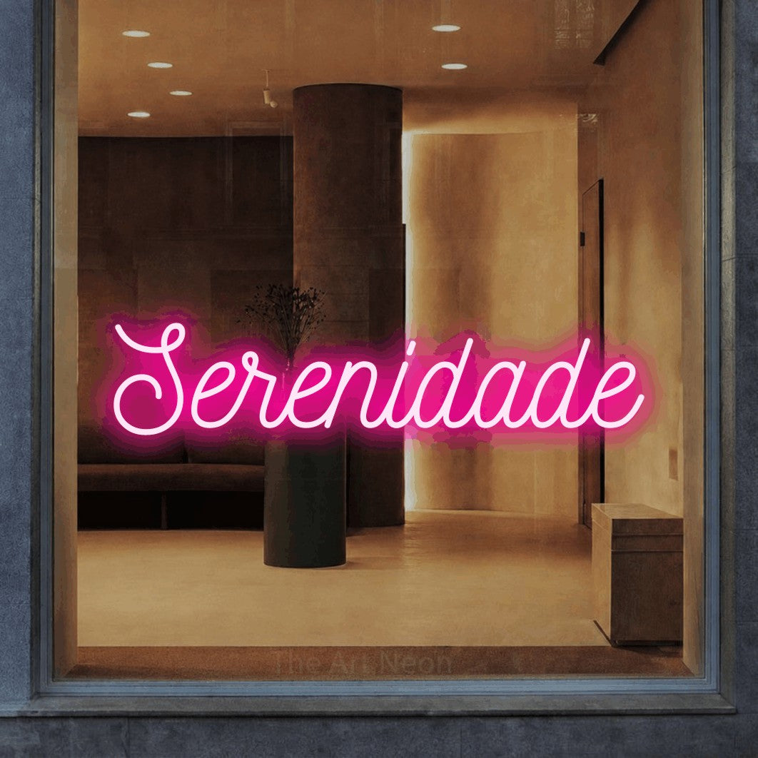 LED neon sign reading “Serenidade”, arranged in a single line.