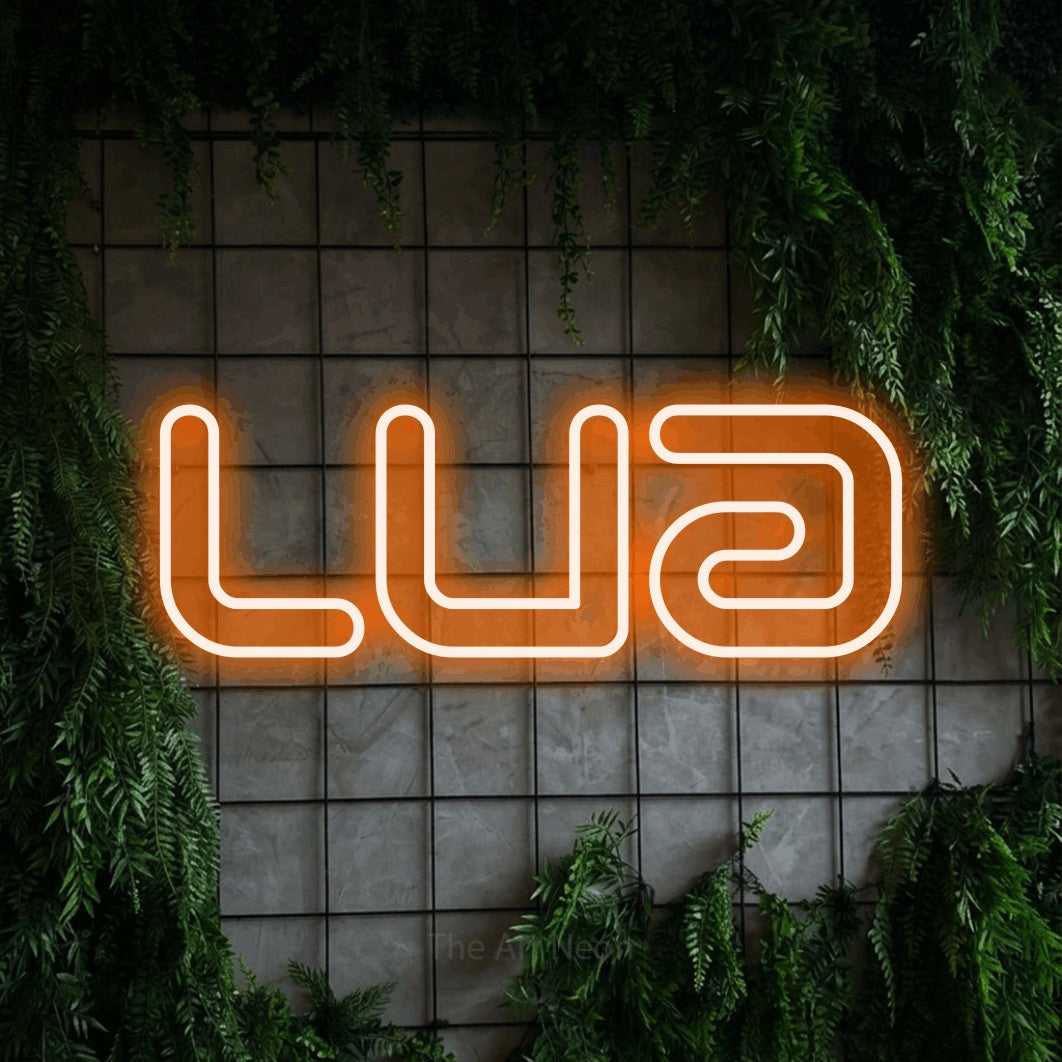 LED neon sign reading “lua”, arranged in a single line.