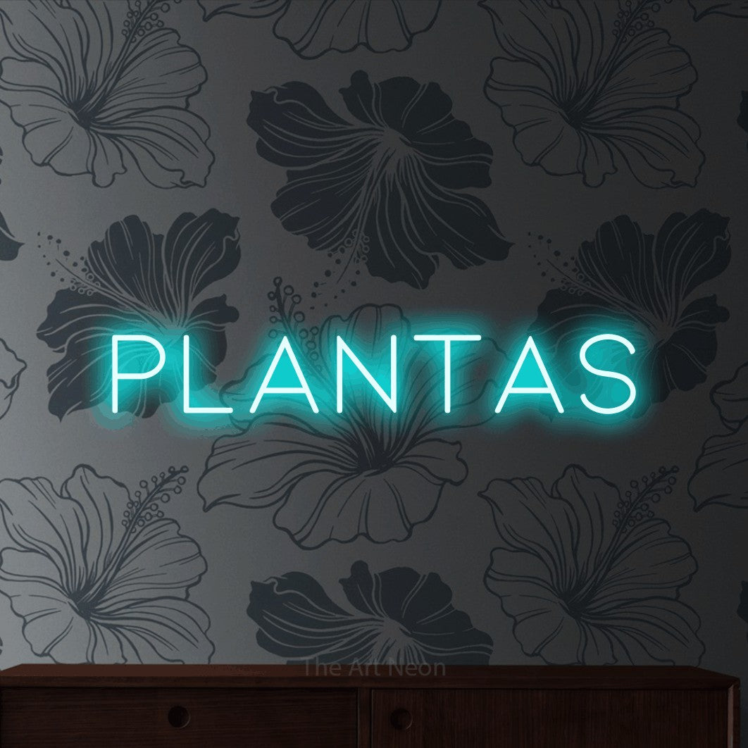 LED neon sign reading “plantas”, arranged in a single line.