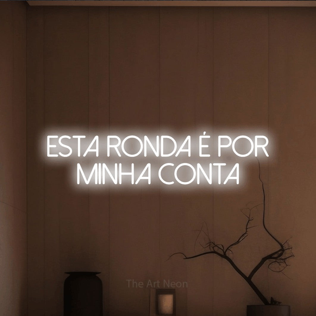LED neon sign reading “esta RONDA é por minha conta”, arranged in 2 lines.
