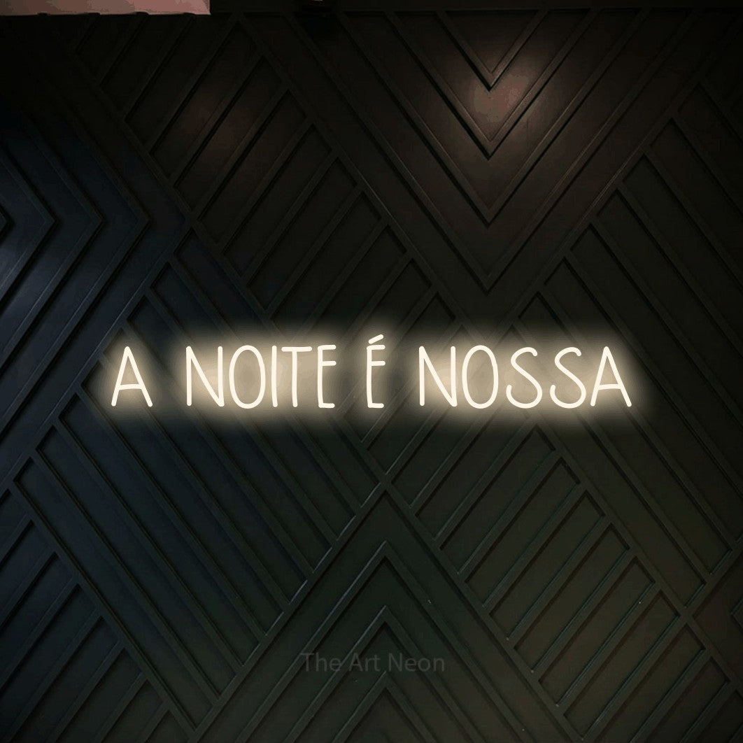 LED neon sign reading “A NOITE É NOSSA”, arranged in a single line.