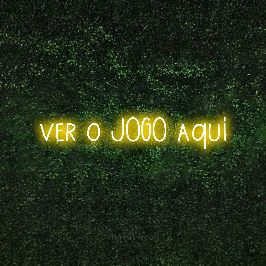 LED neon sign reading “ver o JOGO aqui”, arranged in a single line.