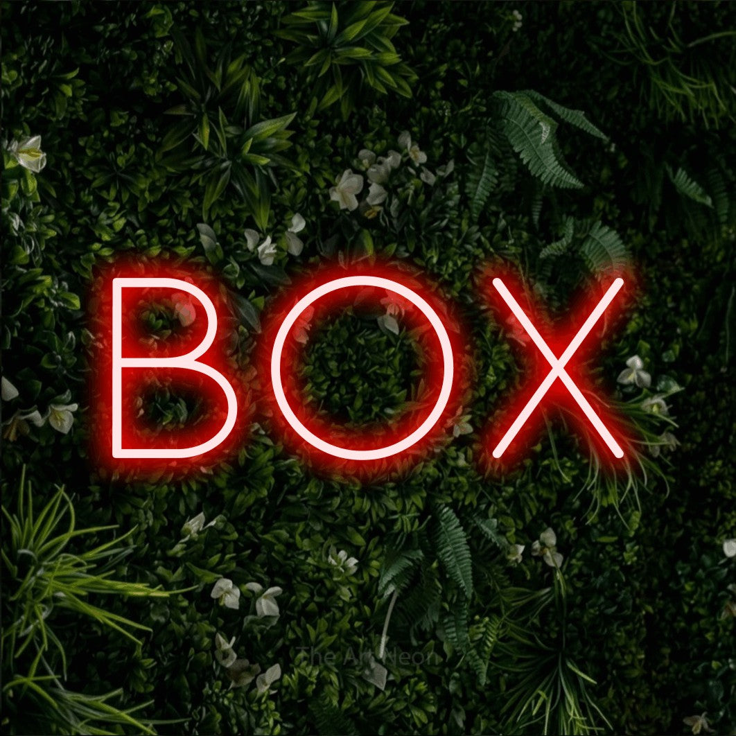 LED neon sign reading “BOX”, arranged in a single line.