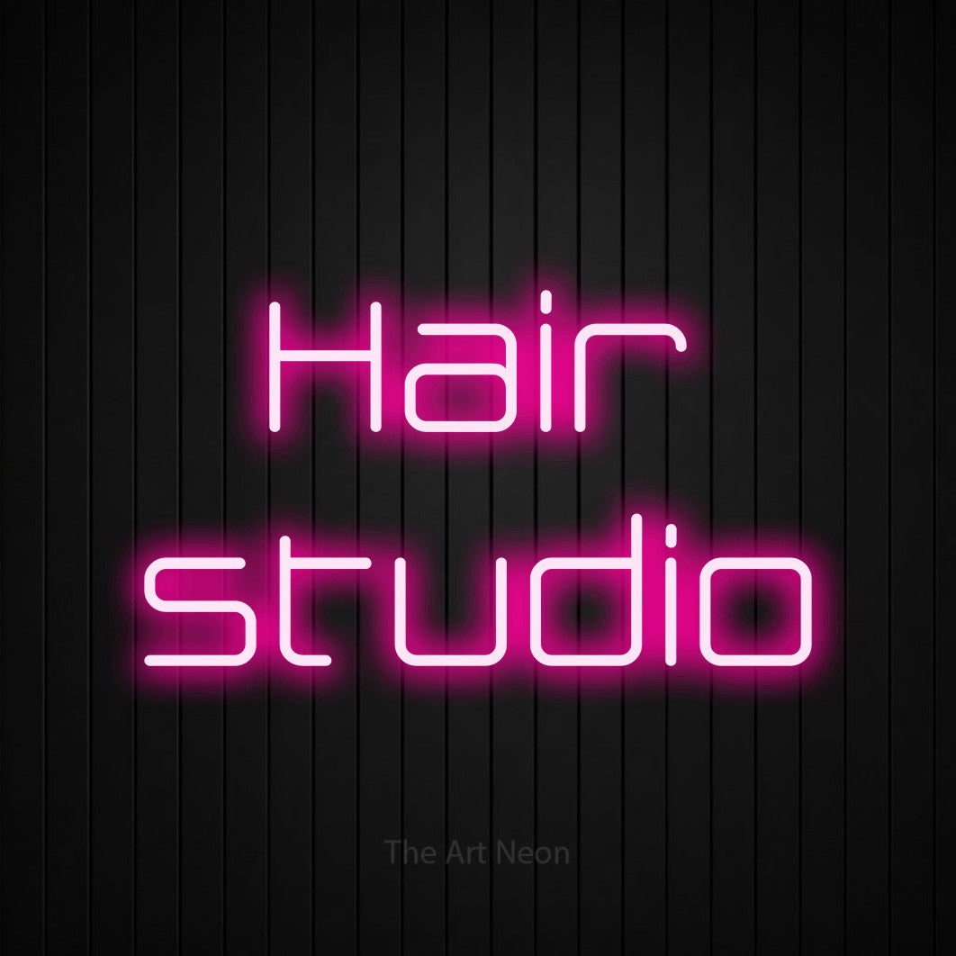 LED neon sign reading “Hair studio”, arranged in 2 lines.