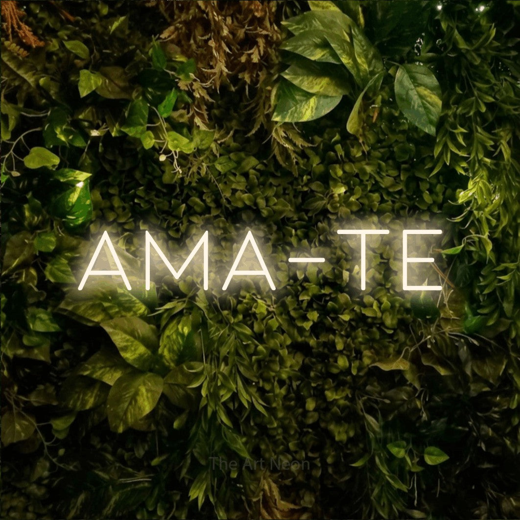 LED neon sign reading “ama-te”, arranged in a single line.