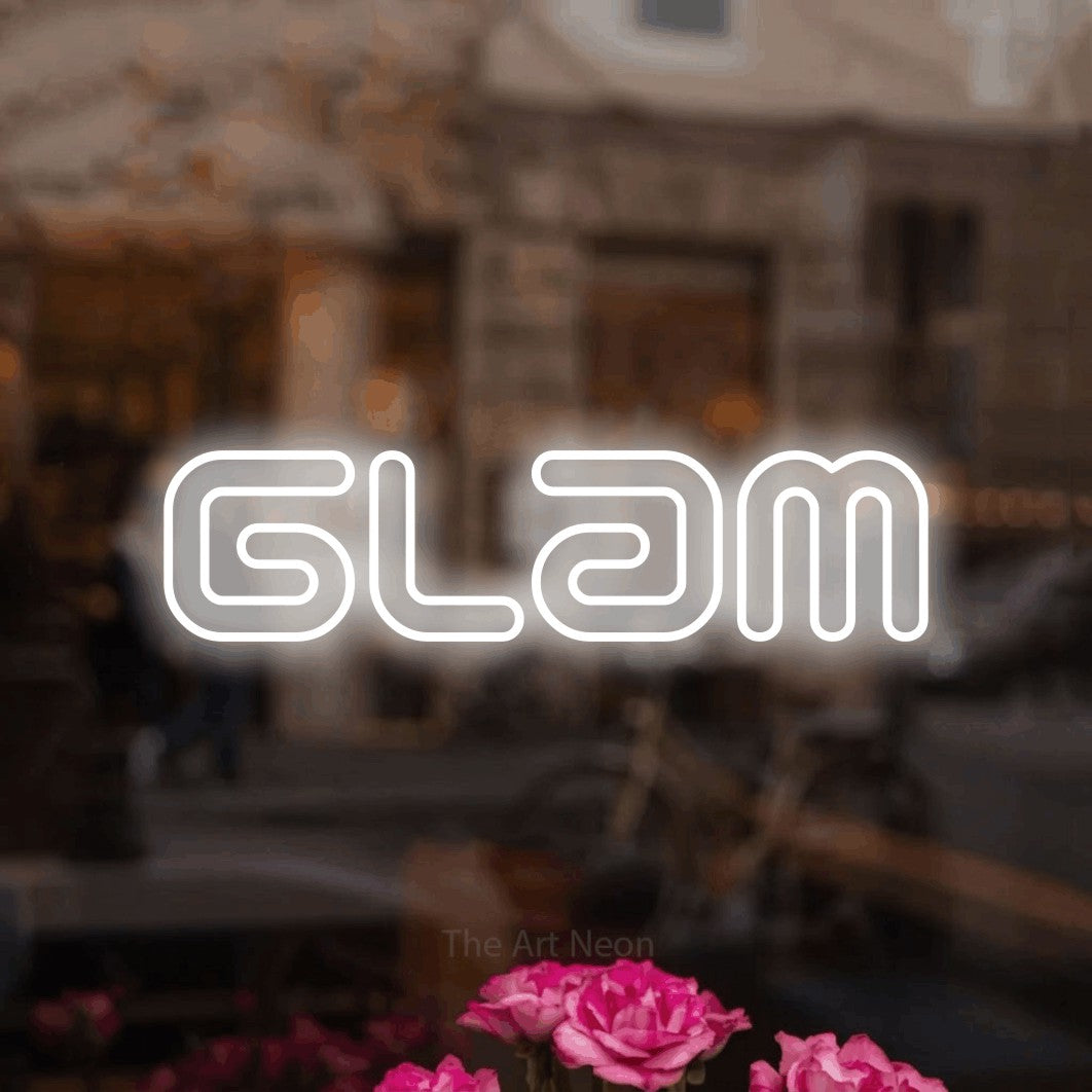 LED neon sign reading “Glam”, arranged in a single line.