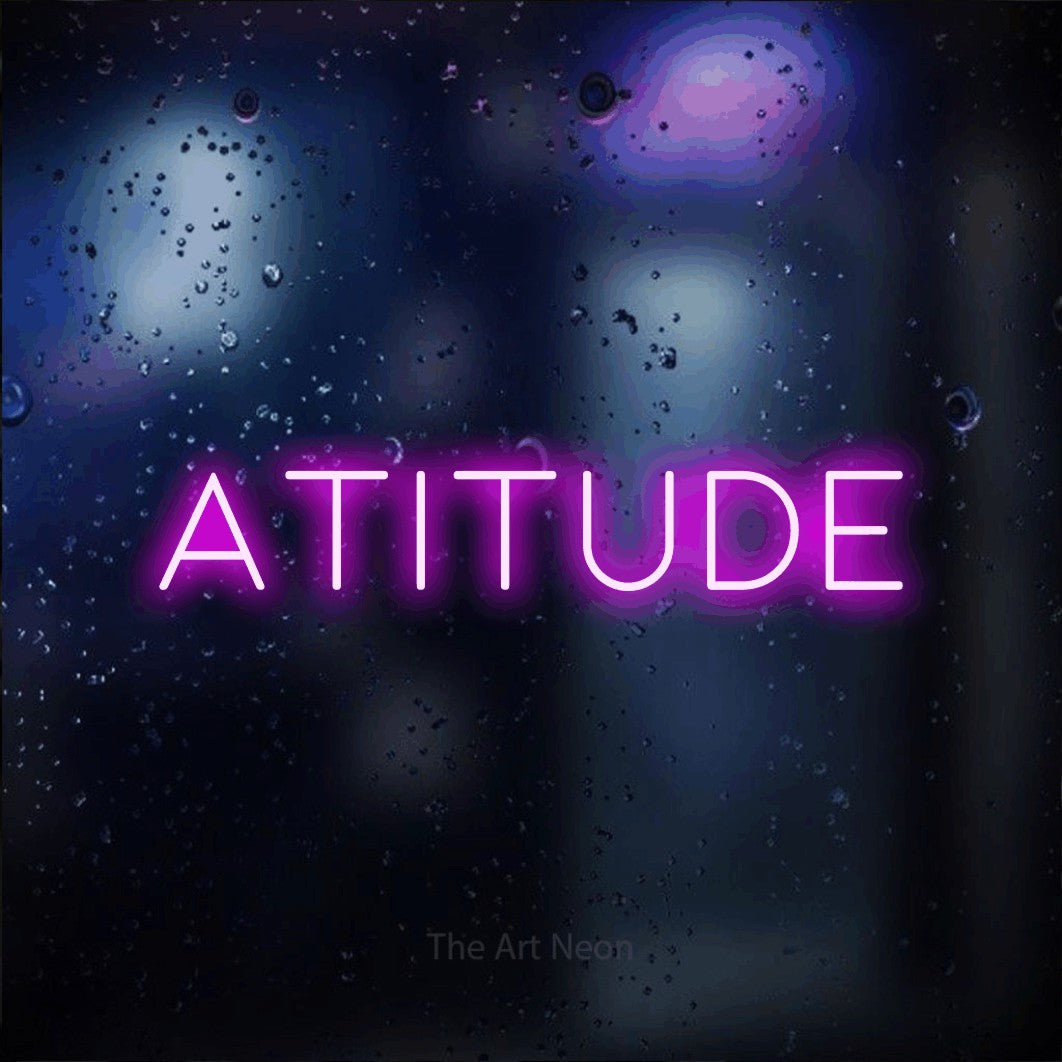 LED neon sign reading “Atitude”, arranged in a single line.