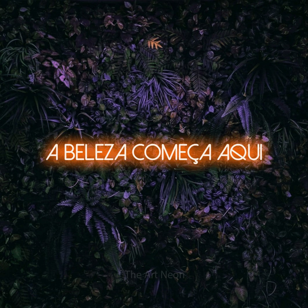LED neon sign reading “a beleza começa aqui”, arranged in a single line.