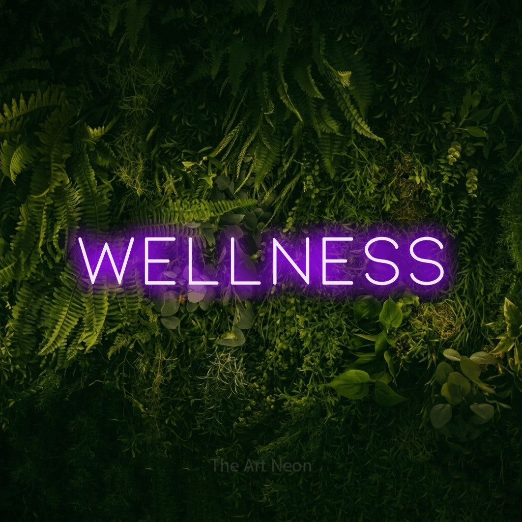 LED neon sign reading “Wellness”, arranged in a single line.