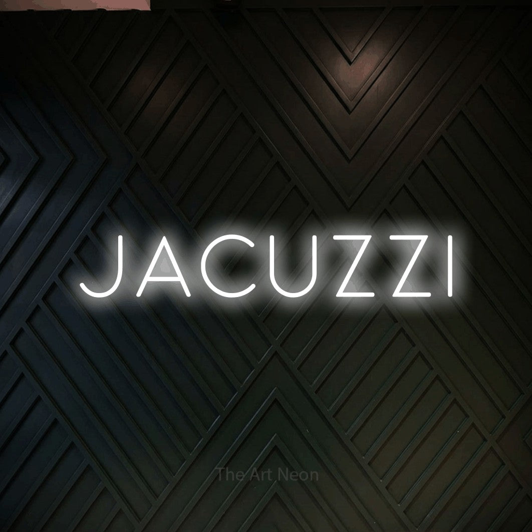 LED neon sign reading “jacuzzi”, arranged in a single line.