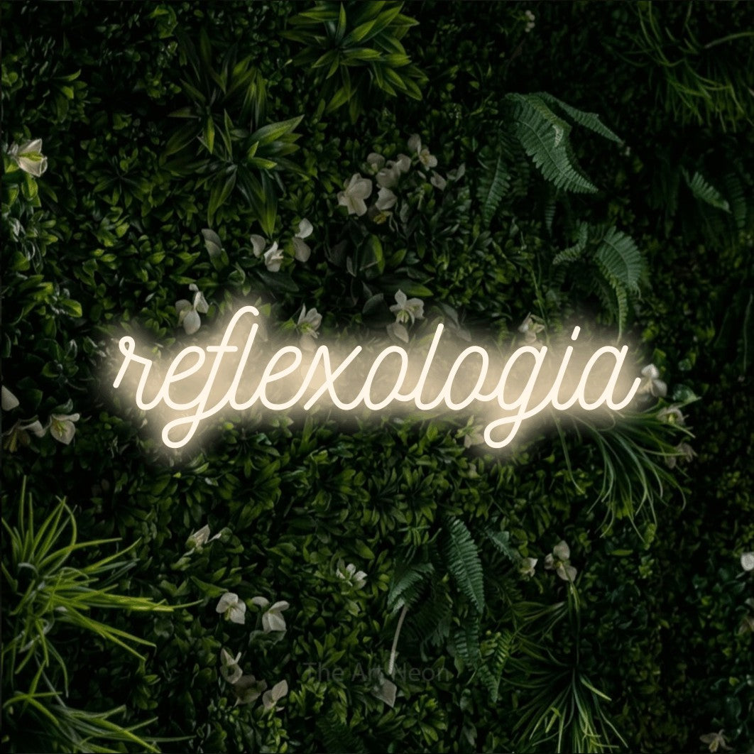 LED neon sign reading “reflexologia”, arranged in a single line.