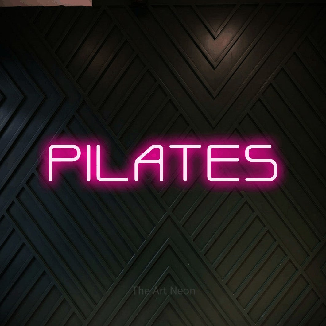 LED neon sign reading “PILATES”, arranged in a single line.