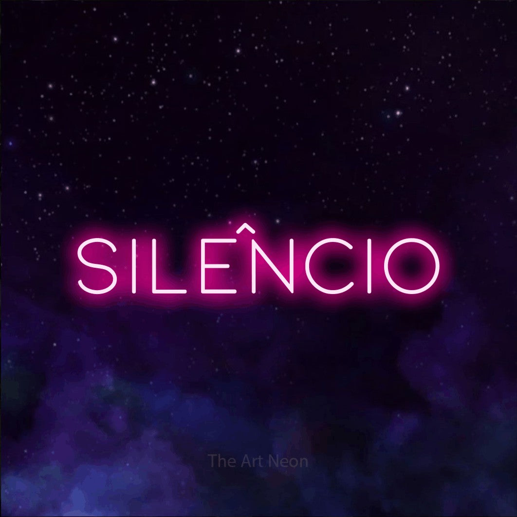 LED neon sign reading “silêncio”, arranged in a single line.