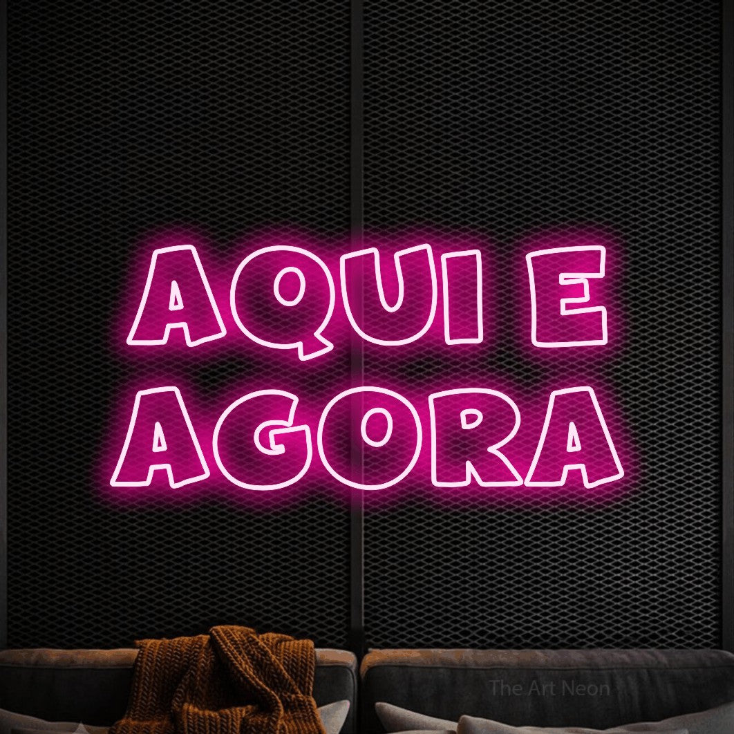 LED neon sign reading “aqui e AGORA”, arranged in 2 lines.