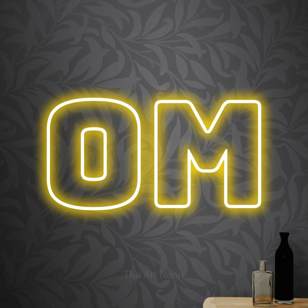 LED neon sign reading “Om”, arranged in a single line.