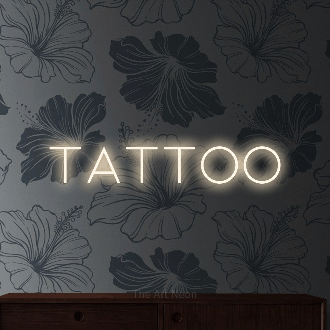 LED neon sign reading “TATTOO”, arranged in a single line.