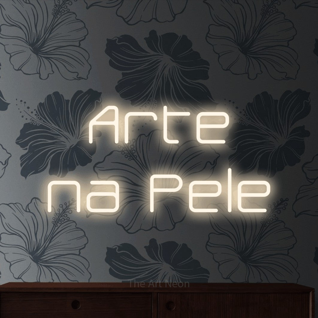 LED neon sign reading “Arte na Pele”, arranged in 2 lines.
