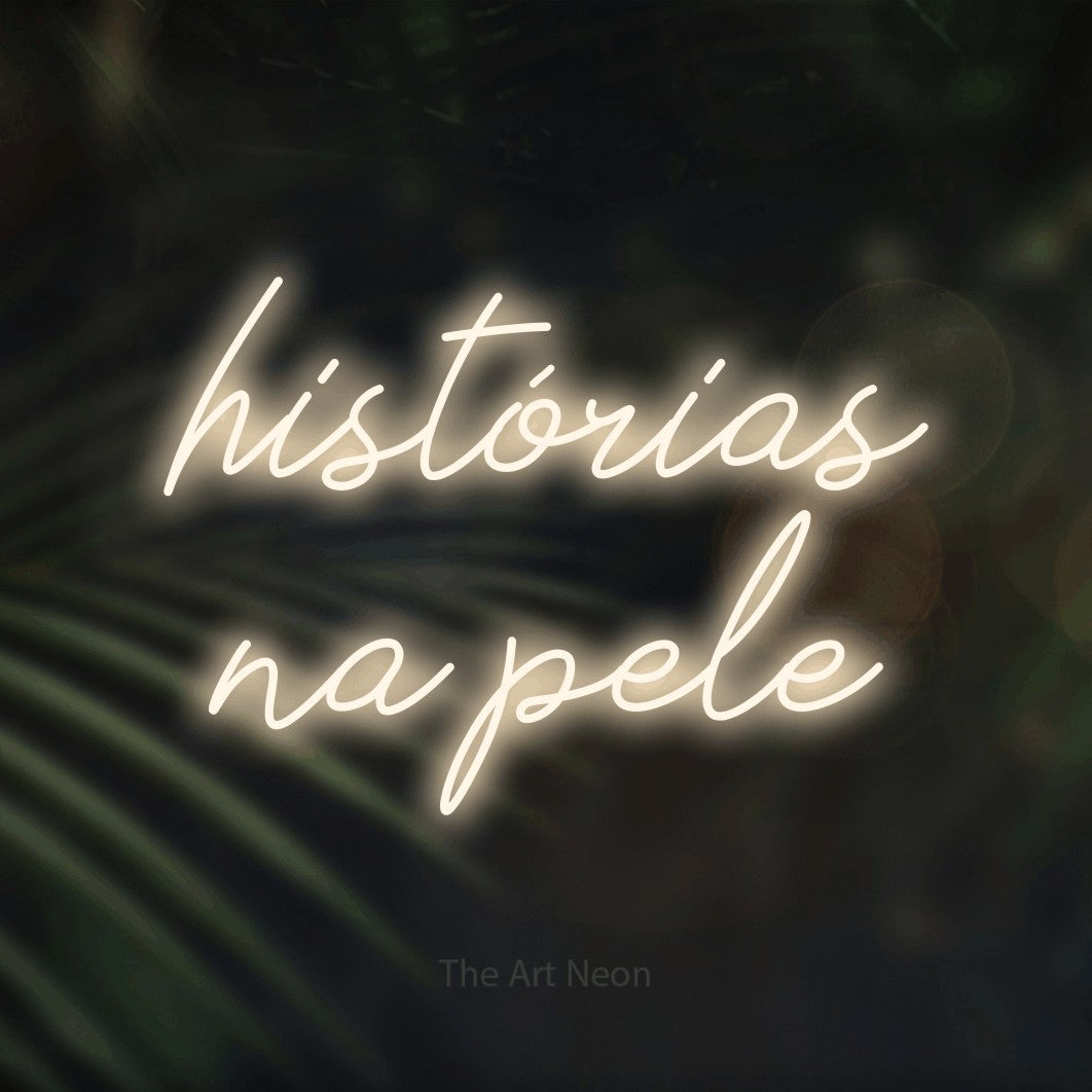 LED neon sign reading “histórias na pele”, arranged in 2 lines.