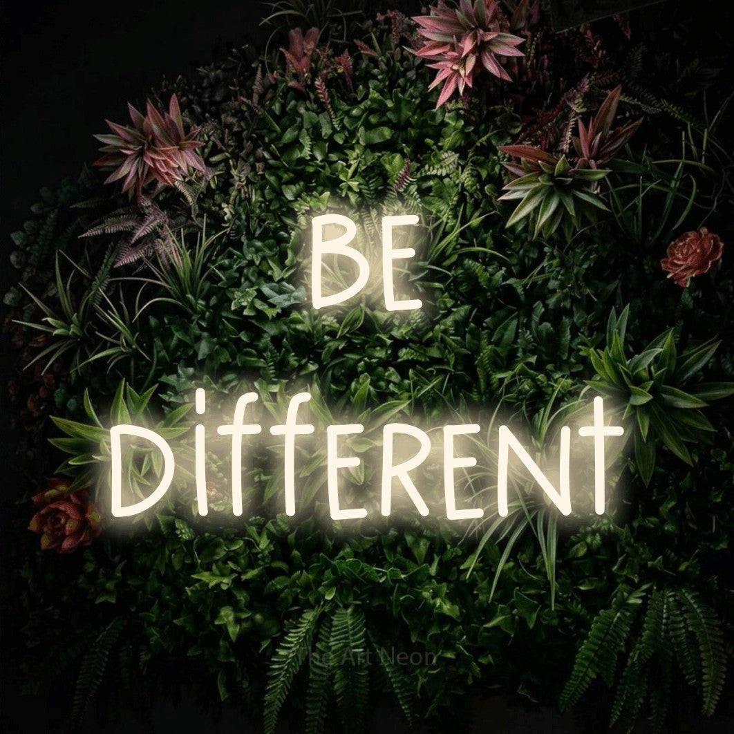 LED neon sign reading “be different”, arranged in 2 lines.