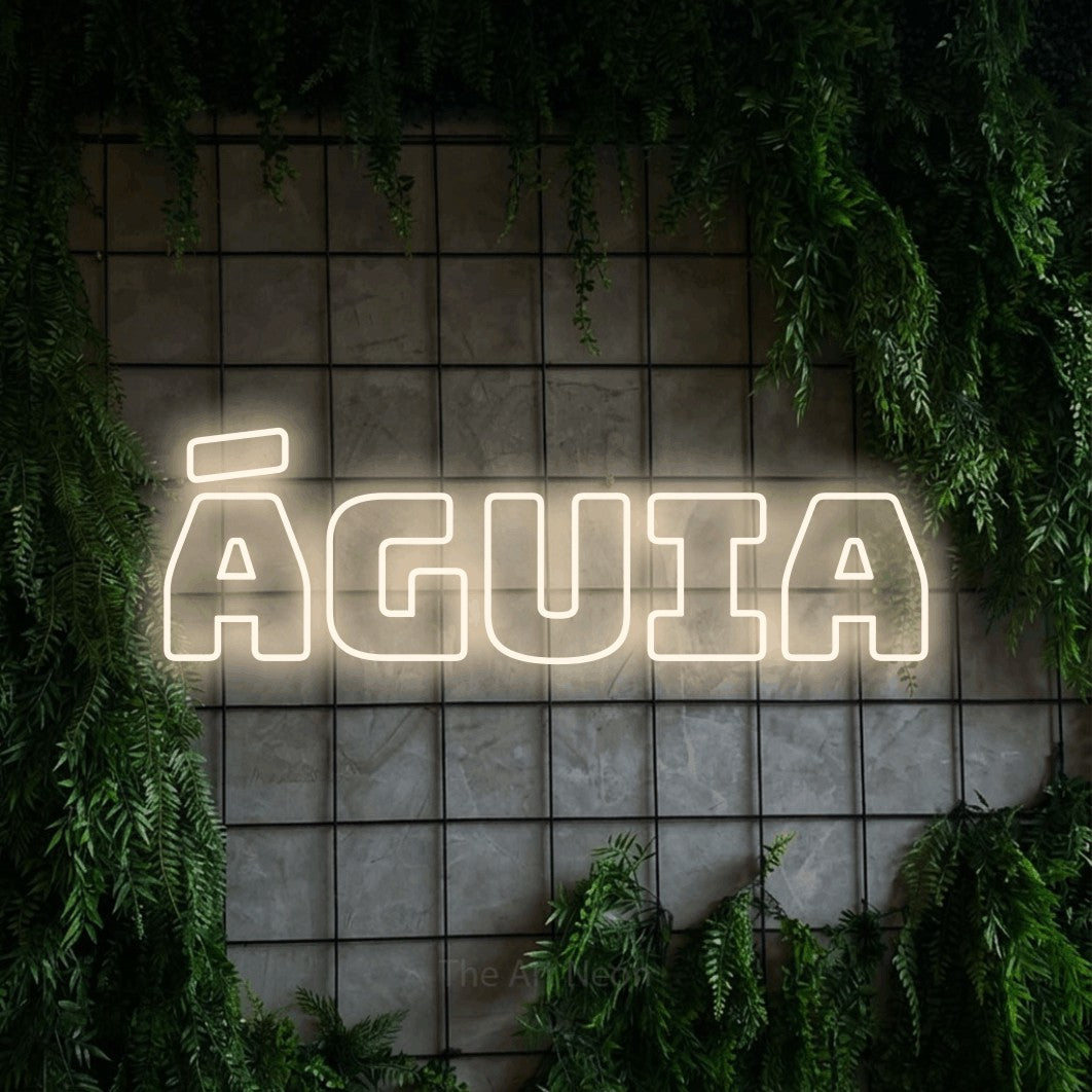 LED neon sign reading “ÁGUIA”, arranged in a single line.