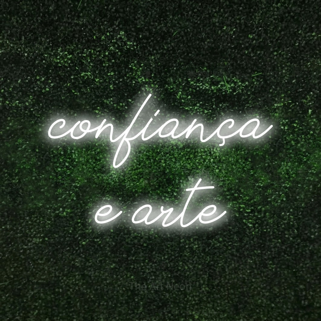 LED neon sign reading “confiança e arte”, arranged in 2 lines.