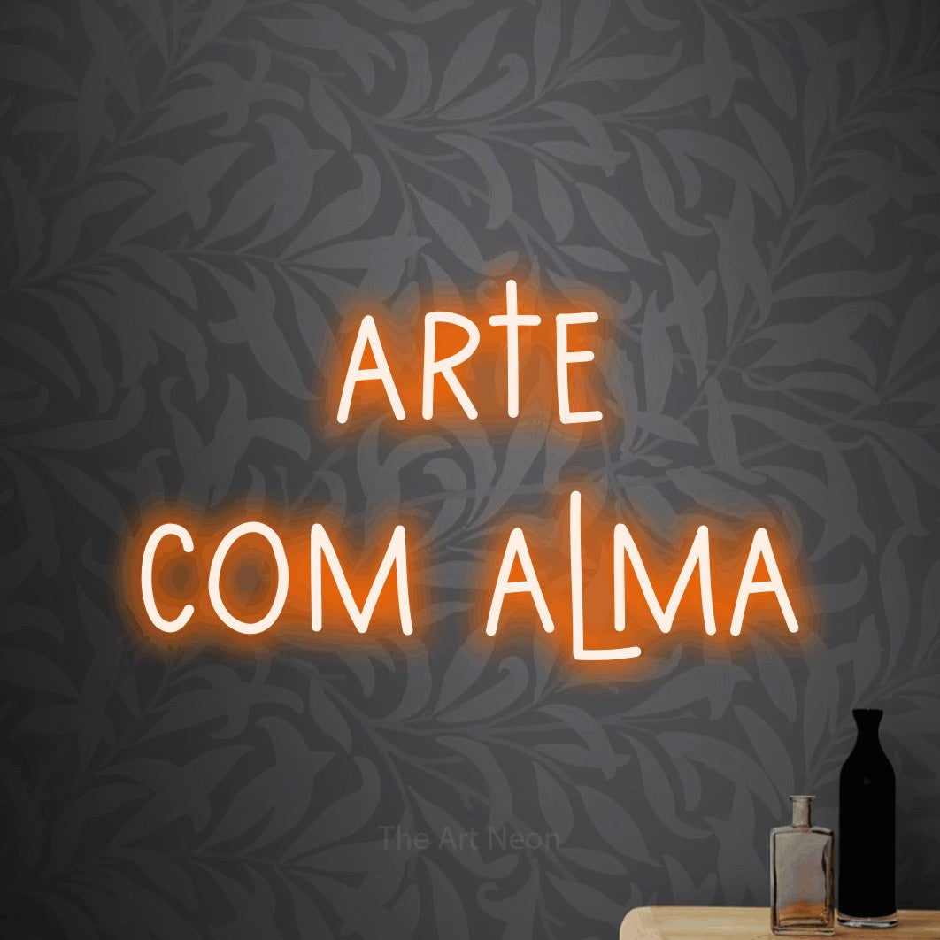 LED neon sign reading “arte com alma”, arranged in 2 lines.
