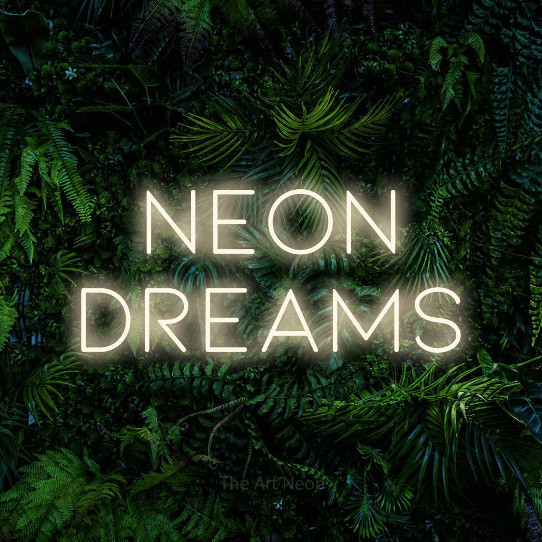 LED neon sign reading “neon dreams”, arranged in 2 lines.