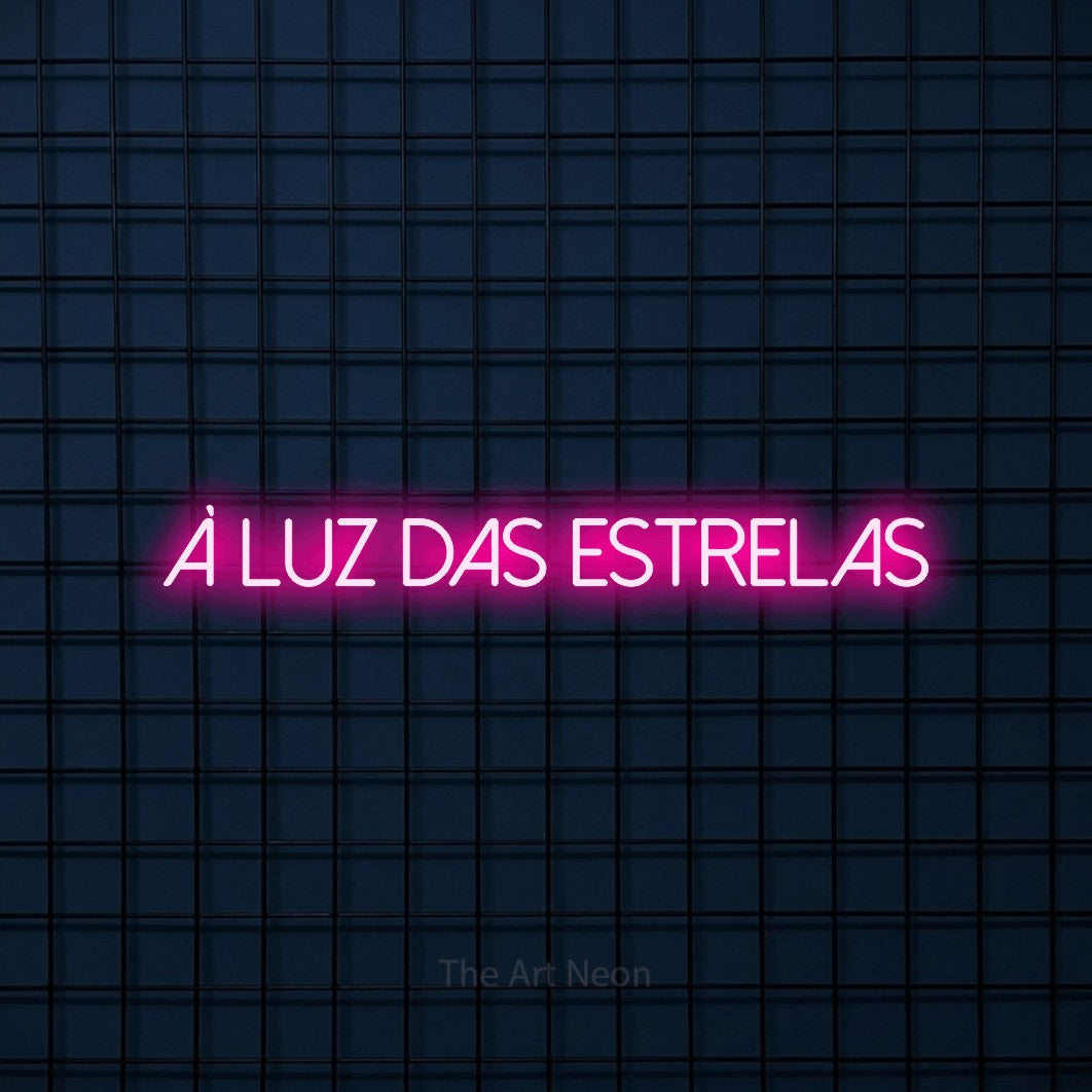 LED neon sign reading “À Luz das Estrelas”, arranged in a single line.