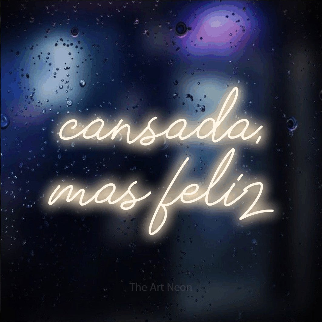 LED neon sign reading “cansada, mas feliz”, arranged in 2 lines.