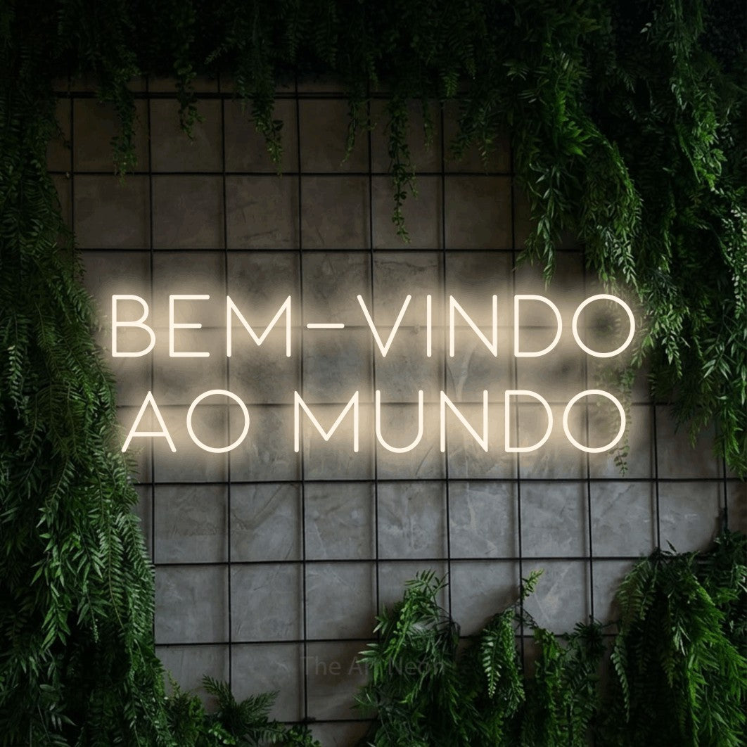 LED neon sign reading “Bem-vindo ao mundo”, arranged in 2 lines.