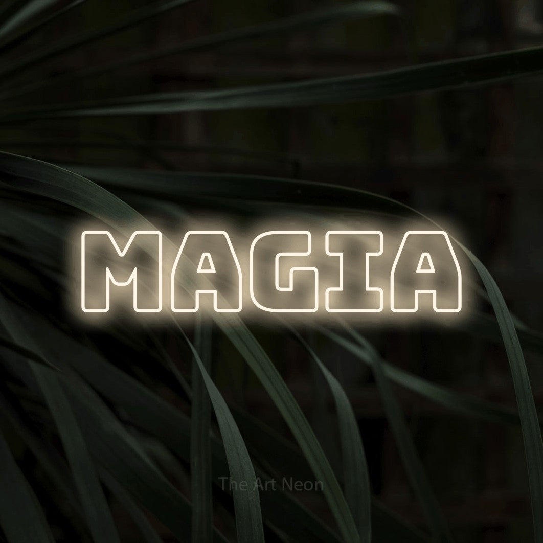 LED neon sign reading “magia”, arranged in a single line.