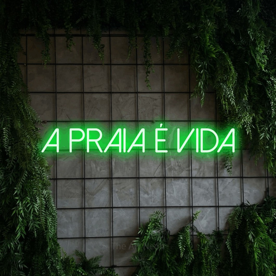 LED neon sign reading “A praia é vida”, arranged in a single line.