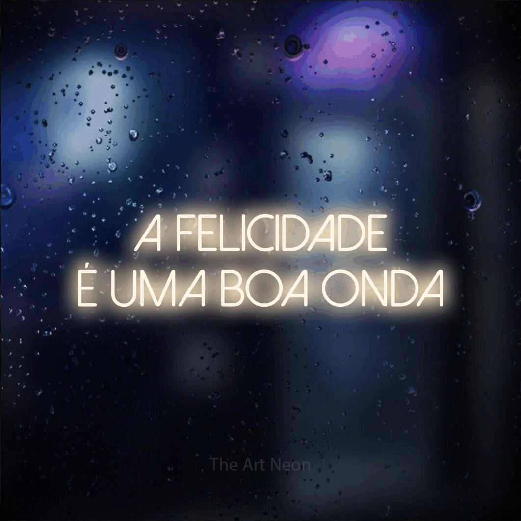 LED neon sign reading “A FELICIDADE É UMA BOA ONDA”, arranged in 2 lines.