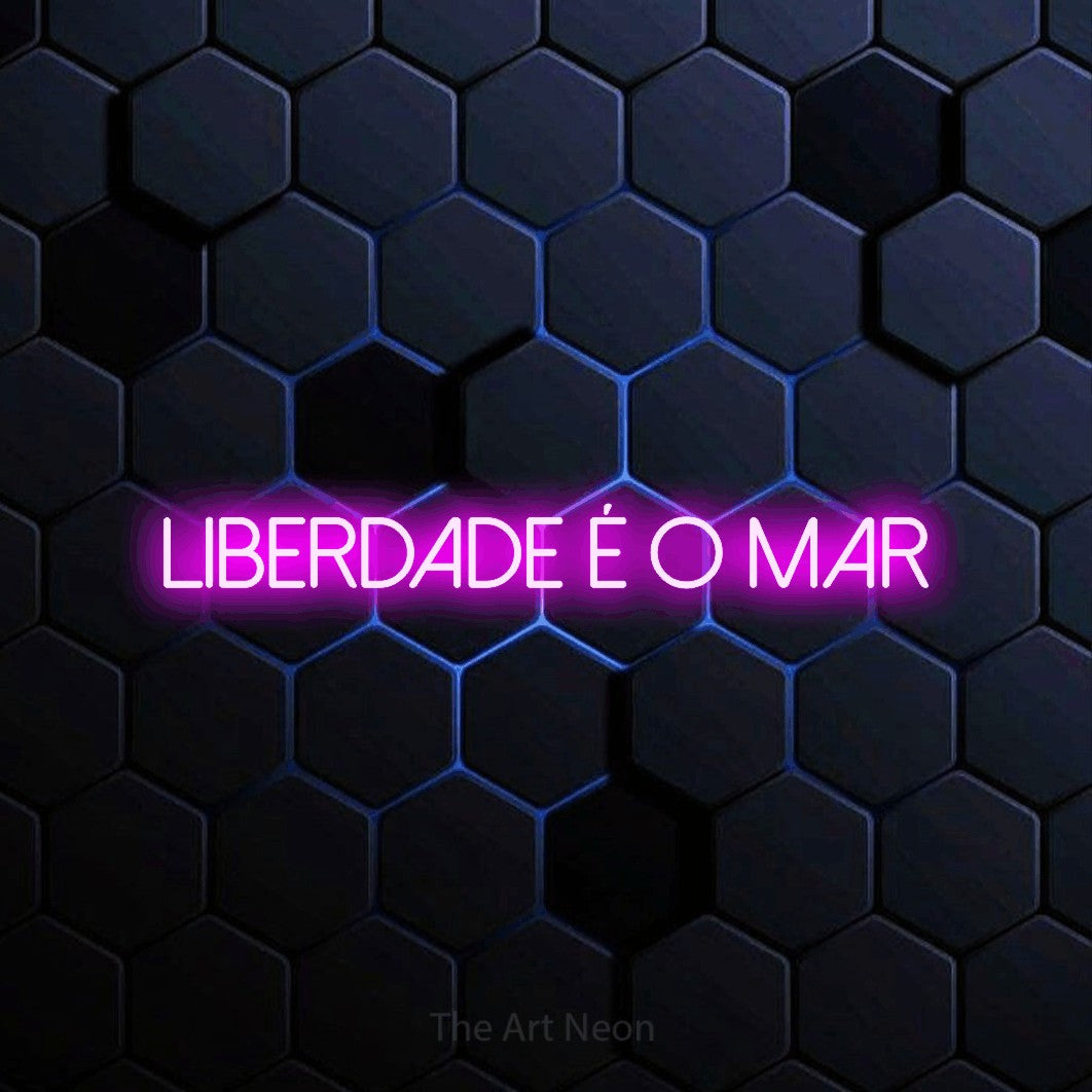 LED neon sign reading “liberdade é o mar”, arranged in a single line.